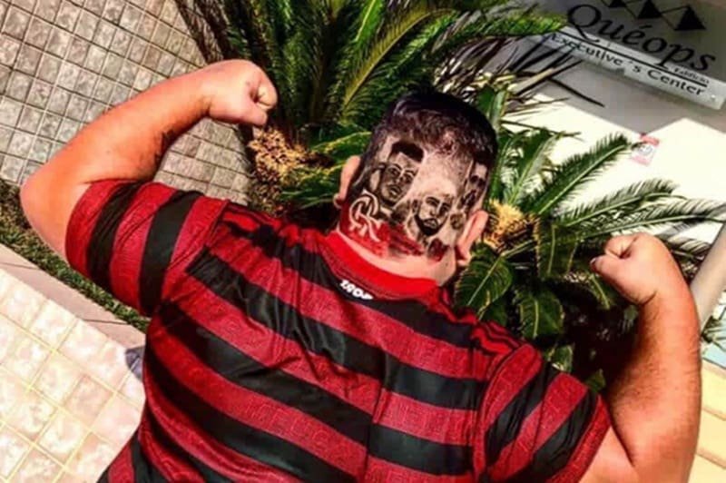 Paixão sem limites Torcedor do Flamengo de costas, com cabelo estilizado com imagens de Gabigol e Bruno Henrique após título da Libertadores 2019